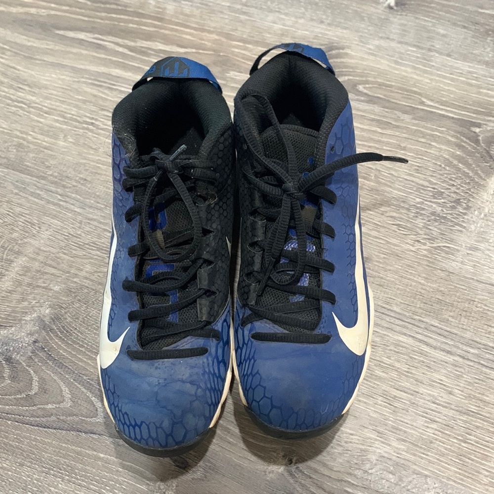Youth blue and black Nike cleats